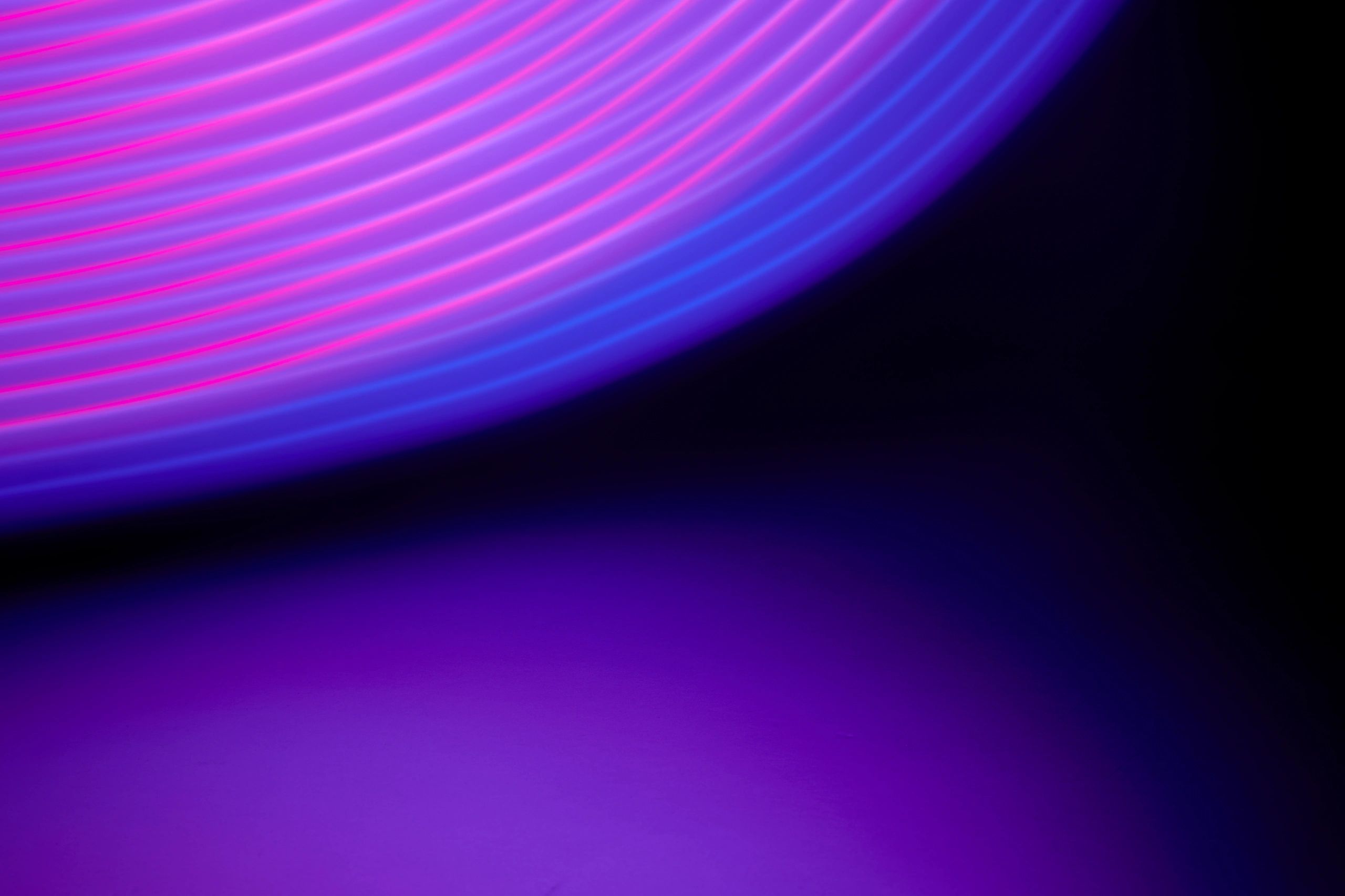Abstract neon light trails representing the YachtStool dice roll